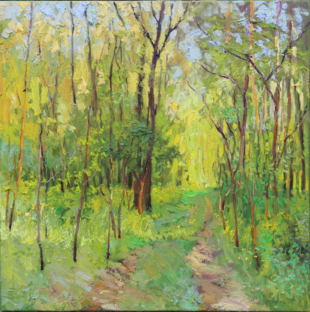 Oil painting of a spring forest path in warm evening light, with lush green grass and young translucent leaves.
